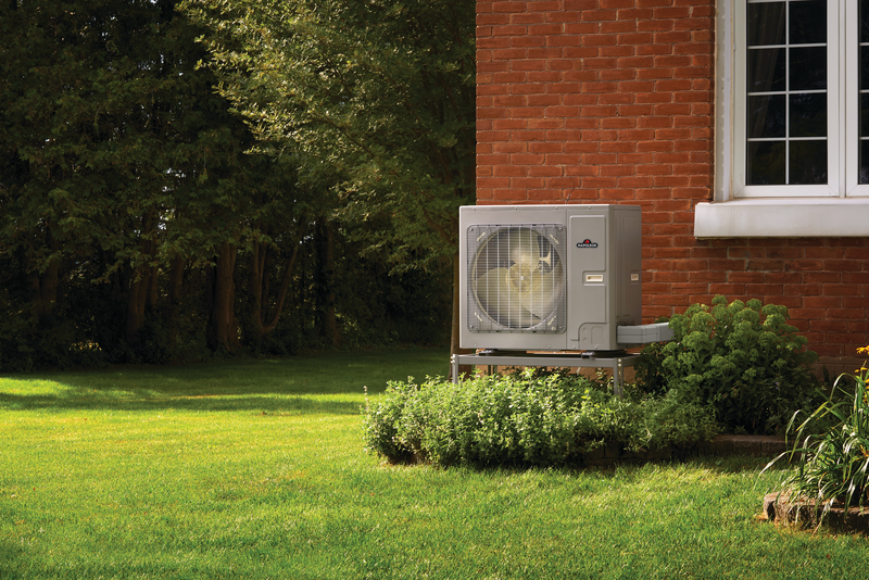 Heat Pump outside a brick home